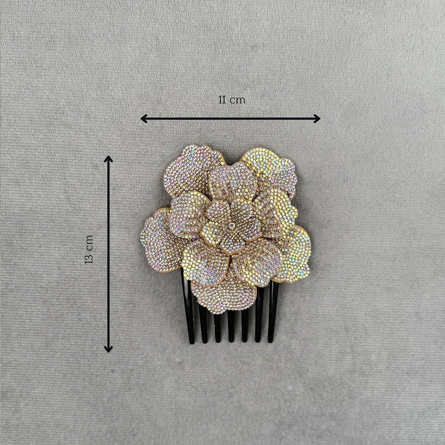 Decorative side hair comb with floral design and measurements on a gray background
