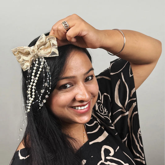 Woman wearing a decorative headpiece with a plain background